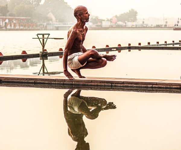 Person maintaining a balance pose reflecting inner stability and strength.